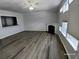 Spacious living room featuring a fireplace, natural light and view into the kitchen at 1510 Paramount Ln, Sugar Hill, GA 30518