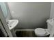 A powder room has a pedestal sink and modern fixtures at 1510 Paramount Ln, Sugar Hill, GA 30518