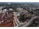 An aerial view of a residential construction site, set in a heavily wooded area at 205 Admor Ln, Acworth, GA 30102