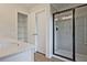 Bathroom with double doors to linen closet and a glass-enclosed shower at 205 Admor Ln, Acworth, GA 30102