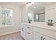 Bathroom features a double sink vanity, and glass-enclosed shower at 205 Admor Ln, Acworth, GA 30102