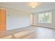 Bright bedroom with wood-look floors, neutral walls and a large window with natural light at 205 Admor Ln, Acworth, GA 30102