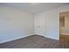 Bedroom featuring gray walls, wood-look flooring and a double-door closet at 205 Admor Ln, Acworth, GA 30102