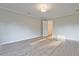 Light-filled bedroom with wood-look floors, neutral walls, and access to a closet at 205 Admor Ln, Acworth, GA 30102