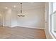 Dining area featuring stylish lighting and convenient access to additional rooms at 205 Admor Ln, Acworth, GA 30102