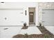 Modern townhome featuring painted white brick and a clearly visible address number and neutral trim at 205 Admor Ln, Acworth, GA 30102