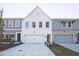 Newly constructed townhomes with a mix of painted brick and siding exteriors, complemented by well-maintained lawns at 205 Admor Ln, Acworth, GA 30102