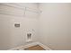 Spacious laundry room featuring light walls, wood-look flooring and wire shelving at 205 Admor Ln, Acworth, GA 30102