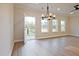 Bright and airy living space with an open door leading to the backyard and ample natural light at 205 Admor Ln, Acworth, GA 30102