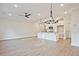 Spacious living area open to the kitchen, featuring modern lighting and ample room for entertaining at 205 Admor Ln, Acworth, GA 30102