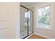 Modern shower with glass doors and natural light at 205 Admor Ln, Acworth, GA 30102