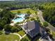 Aerial view of community pool and clubhouse with mature trees and walking paths at 3060 Salisbury Ln, Cumming, GA 30041