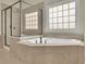 Inviting primary bathroom featuring a large soaking tub and walk-in shower at 3060 Salisbury Ln, Cumming, GA 30041