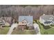 Inviting home with a well-manicured lawn, a covered front porch, and a mix of stone and siding exterior at 3060 Salisbury Ln, Cumming, GA 30041