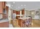 Spacious kitchen features granite countertops, stainless steel appliances, and a large island with barstool seating at 3060 Salisbury Ln, Cumming, GA 30041