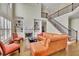 A grand living room boasting soaring ceilings, a fireplace with built-ins, and a staircase to the upper level at 3060 Salisbury Ln, Cumming, GA 30041