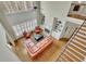 Aerial view of a living room with hardwood floors, a fireplace, and lots of natural light at 3060 Salisbury Ln, Cumming, GA 30041