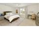 Cozy bedroom with a ceiling fan, desk, and a patterned area rug at 6125 Allison Rd, Cumming, GA 30040