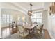 Bright dining room featuring hardwood floors, stylish décor and office area at 6125 Allison Rd, Cumming, GA 30040