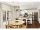 Bright eat-in kitchen with stainless appliances and access to the outdoor patio at 6125 Allison Rd, Cumming, GA 30040