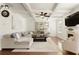 Open living room showcases beautiful coffered ceilings and hardwood flooring at 6125 Allison Rd, Cumming, GA 30040