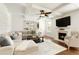 Cozy living room with a fireplace, coffered ceilings, and large windows at 6125 Allison Rd, Cumming, GA 30040