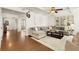 Spacious living room with hardwood floors and an open layout to the rest of the home at 6125 Allison Rd, Cumming, GA 30040