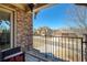 Inviting porch with stone accents, wood deck, and neighborhood views at 6125 Allison Rd, Cumming, GA 30040