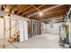 Unfinished basement featuring exposed wood framing, utilities, and stairs for future development at 1731 Fieldgreen Overlook, Stone Mountain, GA 30088