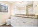 Bright bathroom featuring double sinks, granite countertops, modern fixtures and hardwood floors at 1731 Fieldgreen Overlook, Stone Mountain, GA 30088
