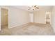 Spacious bedroom with plush carpeting, walk-in closet, ceiling fan, and ensuite bathroom at 1731 Fieldgreen Overlook, Stone Mountain, GA 30088