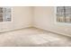 Bedroom with neutral carpet, natural light and two large windows offering a peaceful view at 1731 Fieldgreen Overlook, Stone Mountain, GA 30088