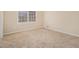 Neutral carpeted bedroom featuring a large window at 1731 Fieldgreen Overlook, Stone Mountain, GA 30088