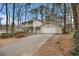 Charming two-story home featuring an attached garage and long driveway at 1731 Fieldgreen Overlook, Stone Mountain, GA 30088