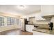 Well-lit kitchen with stainless steel appliances, granite countertops, and ample cabinet space at 1731 Fieldgreen Overlook, Stone Mountain, GA 30088