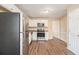 Modern kitchen with stainless steel appliances, granite countertops, and white cabinetry at 1731 Fieldgreen Overlook, Stone Mountain, GA 30088