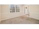 Cozy room featuring chair rail and view of front door at 1731 Fieldgreen Overlook, Stone Mountain, GA 30088