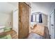 En-suite bathroom visible from bedroom, featuring wood sliding door at 279 Scarborough Rd, Stockbridge, GA 30281