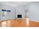 Cozy living room featuring hardwood floors, vaulted ceilings, and a stone fireplace at 279 Scarborough Rd, Stockbridge, GA 30281