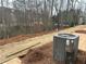 New construction backyard, featuring pine straw ground cover at 412 Carrera Ln, Acworth, GA 30102