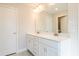 Bathroom with a white double vanity, stylish fixtures, and a large mirror with great lighting at 412 Carrera Ln, Acworth, GA 30102