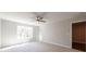 Bright bedroom featuring neutral walls, a ceiling fan, and a sunny window with natural light at 412 Carrera Ln, Acworth, GA 30102