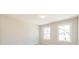 Bedroom with neutral walls and carpet, featuring two large windows for natural light at 412 Carrera Ln, Acworth, GA 30102