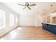 Spacious living area with hardwood floors, modern lighting, and kitchen island at 412 Carrera Ln, Acworth, GA 30102