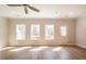 Bright living area boasts hardwood floors, recessed lighting, and natural light from three windows at 412 Carrera Ln, Acworth, GA 30102