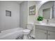 Bathroom featuring a tub, toilet, vanity, and tile flooring at 1230 Scenic Brook Sw Trl, Conyers, GA 30094