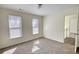 Bright bedroom featuring soft carpeting, and natural light creating a serene and inviting atmosphere perfect for relaxation at 1230 Scenic Brook Sw Trl, Conyers, GA 30094