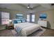 Serene bedroom with a tray ceiling, plush carpet, comfortable bed, and plenty of natural light at 1230 Scenic Brook Sw Trl, Conyers, GA 30094