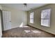 Bedroom with natural lighting, carpet flooring, and a neutral color palette at 1230 Scenic Brook Sw Trl, Conyers, GA 30094
