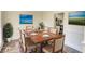 An elegant dining room boasting a large wood table, comfortable seating, and stylish decor at 1230 Scenic Brook Sw Trl, Conyers, GA 30094